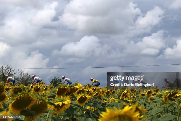 Julien Simon of France and Team Total Energies - Yellow Leader Jersey, Sandy Dujardin of France and Team Total Energies - Blue Points Jersey and a...