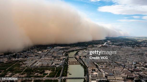 Aerial view of an approaching sandstorm over Jiuquan city on August 17, 2022 in Jiuquan, Gansu Province of China.
