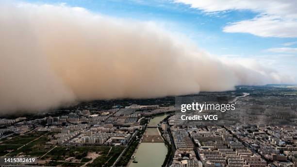 Aerial view of an approaching sandstorm over Jiuquan city on August 17, 2022 in Jiuquan, Gansu Province of China.