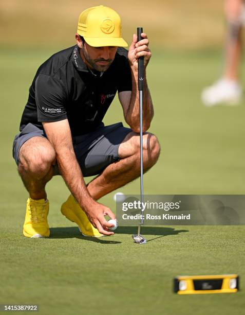 Joel Stalter of France with colour coordinated cap, shoes and spirit level on the practice putting green during the pro-am event prior to the D+D...