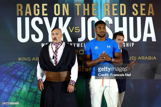 Oleksandr Usyk and Anthony Joshua pose for a photo during the Rage on the Red Sea Press Conference at Shangri-La Hotel on August 17, 2022 in Riyadh,...