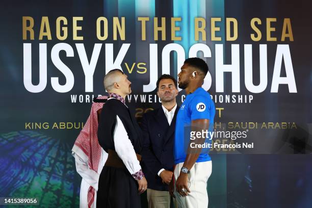 Oleksandr Usyk and Anthony Joshua face off during the Rage on the Red Sea Press Conference at Shangri-La Hotel on August 17, 2022 in Riyadh, Saudi...