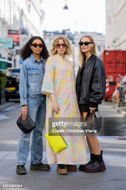 Sara Flaaen Licius wearing denim jacket, jeans, black Copenhagen Studios bag and boots & Pernille Rosenkilde wearing colorful dress, yellow...