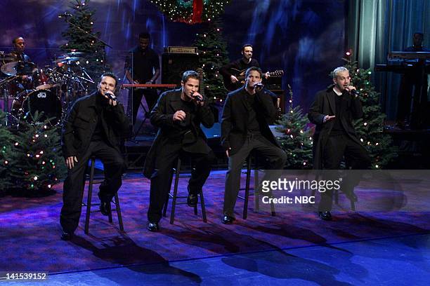 Episode 1728 -- Pictured: Drew Lachey, Nick Lachey, Jeffrey Timmons, Justin Jeffre of musical guest 98 Degrees performs on November 29, 1999 -- Photo...