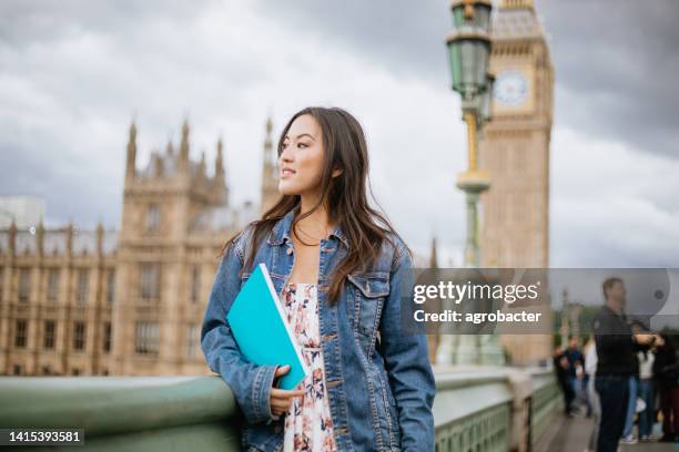 happy asian female student in london - study abroad stock pictures, royalty-free photos & images