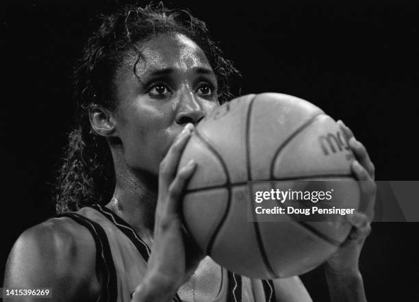 This image has been converted to black and white) Lisa Leslie, Center for the United States women's basketball team concentrates her eyes to make a...