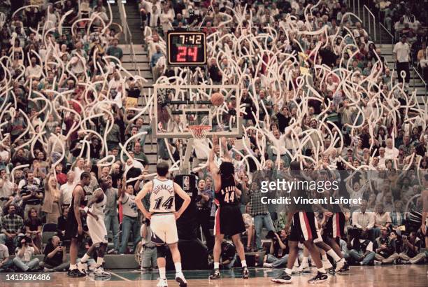 Brian Grant, Power Forward, Center, and Small Forward for the Portland Trail Blazers shoots a free throw to the basket as the Utah Jazz fans attempt...