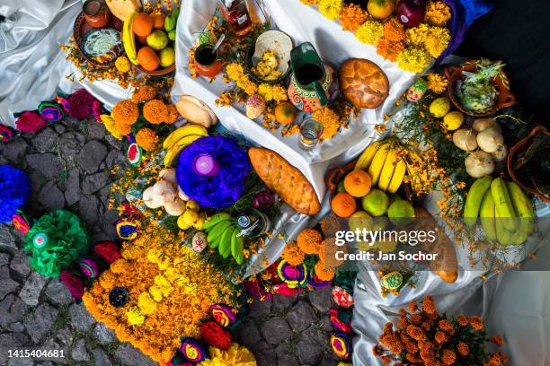 Food offerings are placed at the altar of the dead , a religious site honoring the deceased, during the Day of the Dead celebrations on October 30,...