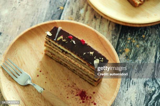 a slice of raspberry cheese opera cake - opera cake stock pictures, royalty-free photos & images