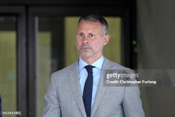 Ryan Giggs leaves Manchester Crown Court with his legal team on August 17, 2022 in Manchester, England. The former Manchester United midfielder and...