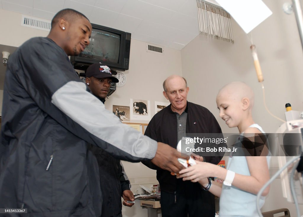 Miami Hurricanes players and HC Larry Coker visit City of Hope