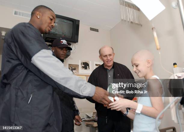 Miami Hurricanes players Mike Rumph , Clinton Portis and Head Coach Larry Coker visit with Pediatric cancer patient during visit to the City of Hope,...