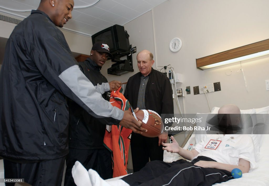 Miami Hurricanes players and HC Larry Coker visit City of Hope
