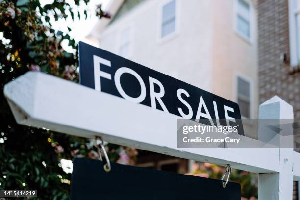 for sale sign in front yard of house - real estate sign stock pictures, royalty-free photos & images