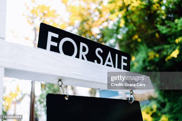 for sale sign in front yard of house - property for sale stock pictures, royalty-free photos & images