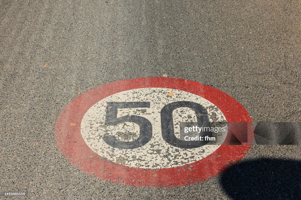 German traffic sign: Speedlimit 50, painted on the street