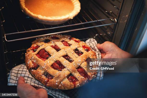 baking berry pie in the oven - pie bildbanksfoton och bilder