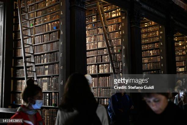 General view as tourists visit the Library of Trinity College on August 17, 2022 in Dublin, Ireland. The Library of Trinity College Dublin serves the...