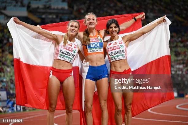 Silver medalist Natalia Kaczmarek of Poland, Gold medalist Femke Bol of The Netherlands and Bronze medalist Anna Kielbasinska of Poland celebrate...