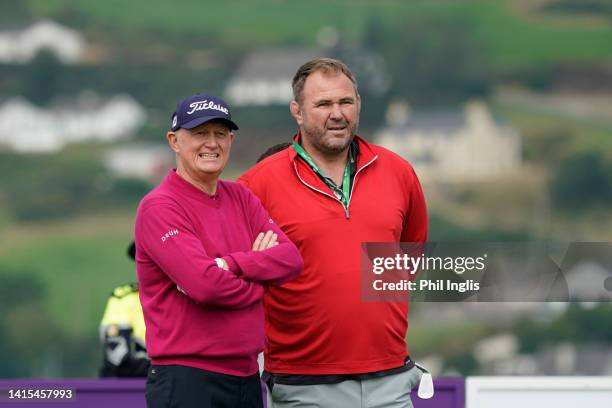 Welsh International Rugby Union star Scott Quinnell with Roger Chapman of England watch play during the Celebrity Series prior to the Irish Legends...