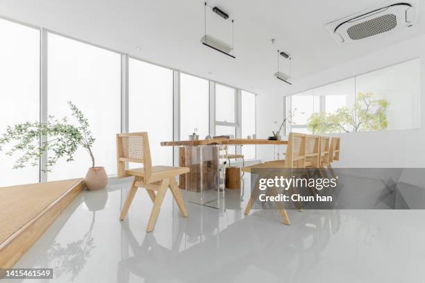 tables, chairs and tea sets in the clean and empty tea house - porcelain floor stock pictures, royalty-free photos & images