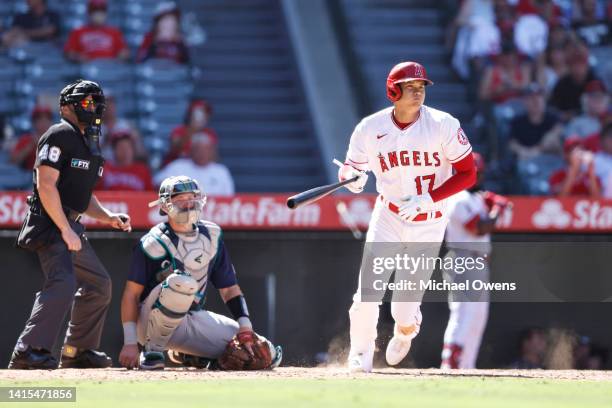 Shohei Ohtani of the Los Angeles Angels hits an RBI triple against the Seattle Mariners during the seventh inning at Angel Stadium of Anaheim on...