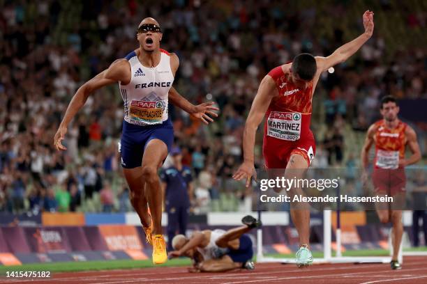 Asier Martinez of Spain and Pascal Martinot-Lagarde of France reach for the finish line in the Men's 110m Hurdles Final during the Athletics...