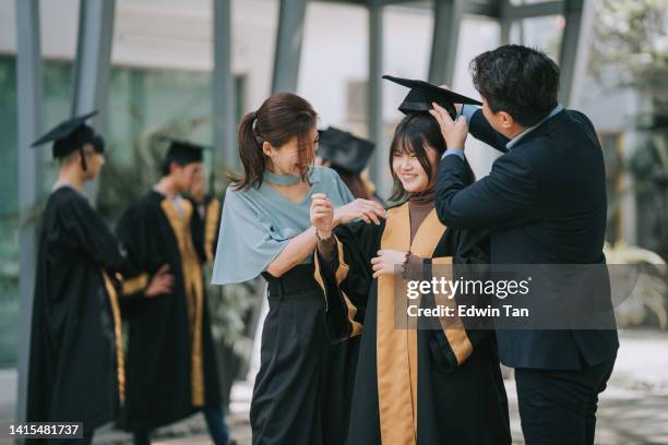Asian Graduation University Parents Asian Photos and Premium High Res Pictures - Getty ...