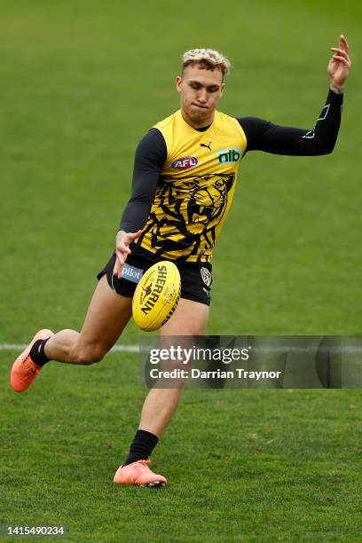 Shai Bolton of the Tigers kicks the ball during a Richmond Tigers AFL training session at Punt Road Oval on August 18, 2022 in Melbourne, Australia.