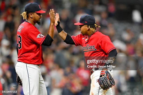 Closing pitcher Emmanuel Clase of the Cleveland Guardians celebrates with Jose Ramirez after the Guardians defeated the Detroit Tigers at Progressive...