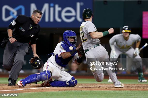 Sean Murphy of the Oakland Athletics scores against Meibrys Viloria of the Texas Rangers on a RBI double hit by Chad Pinder of the Oakland Athletics...