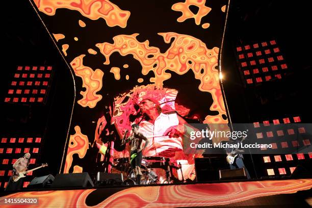 Flea, Anthony Kiedis and John Frusciante of the Red Hot Chili Peppers perform at MetLife Stadium on August 17, 2022 in East Rutherford, New Jersey.