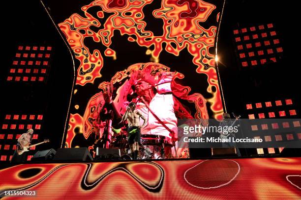 Flea, Anthony Kiedis and John Frusciante of the Red Hot Chili Peppers perform at MetLife Stadium on August 17, 2022 in East Rutherford, New Jersey.