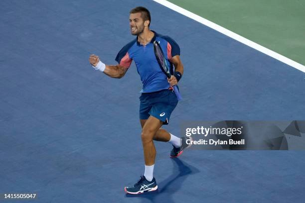 Borna Coric of Croatia celebrates after beating Rafael Nadal of Spain 7-6, 4-6, 6-3 during the Western & Southern Open at the Lindner Family Tennis...