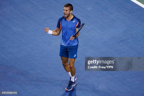 Borna Coric of Croatia celebrates his victory over Rafael Nadal of Spain in the second round of the men's singles at the Lindner Family Tennis Center...