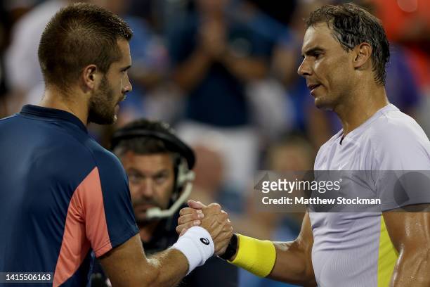Borna Coric of Croatia is congratulated by Rafael Nadal of Spain after their match during the Western & Southern Open at Lindner Family Tennis Center...