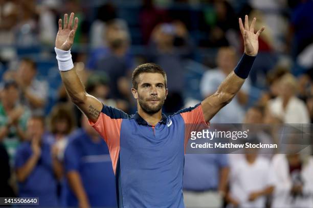 Borna Coric of Croatia celebrates his win over Rafael Nadal of Spain during the Western & Southern Open at Lindner Family Tennis Center on August 17,...