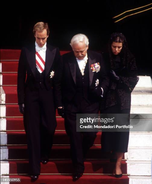 Prince Rainier III of Monaco taking part to the funeral of his wife, the American actress Grace Kelly. His children Caroline and Albert of Monaco...