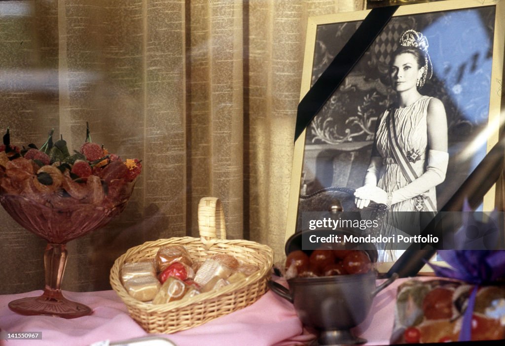 A Grace Kelly'S Photograph Draped In Mourning In The Shop-Window Of A Confectionery