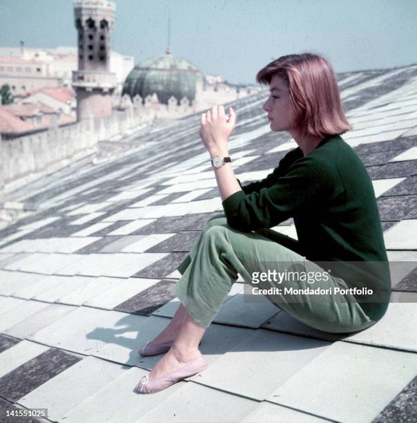 The French actress Anouk Aimee sitting on the Hotel Excelsior roof. Venice, 1955
