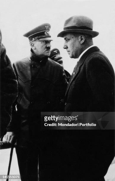 The German Chancellor Adolf Hitler posing next to the Nazi hierarch Martin Bormann. Germany, 1945