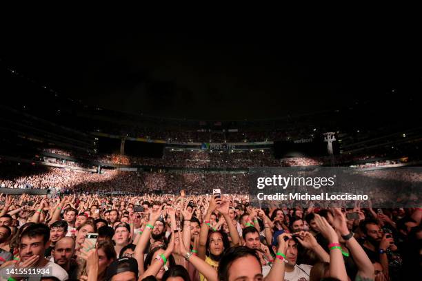 Attendees watch the Red Hot Chili Peppers perfor at MetLife Stadium on August 17, 2022 in East Rutherford, New Jersey.