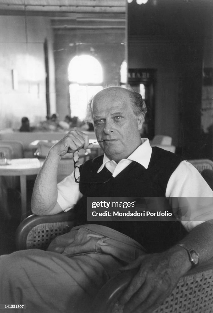 Adriano Olivetti Sitting In A Bar