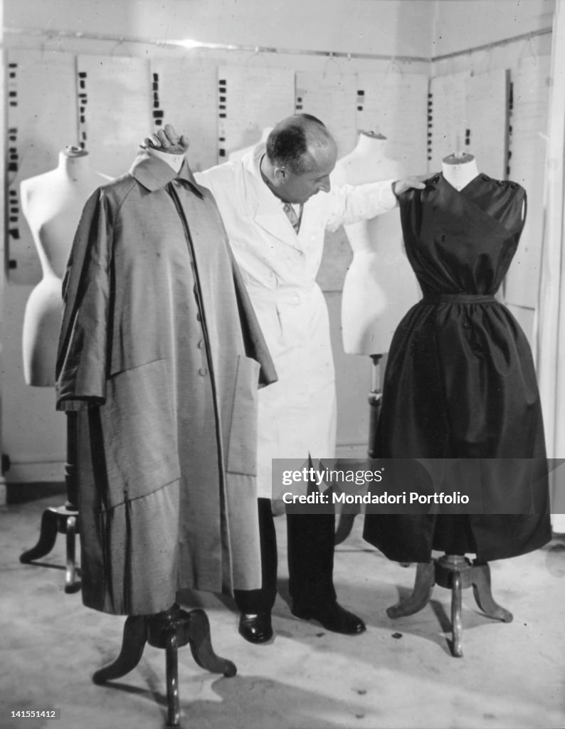 Christian Dior Amid Some Dummies In His Atelier