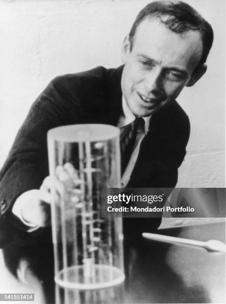 The american biologist James Watson watching a reproduction of the DNA double helix discovered by him. USA, 18th October 1962