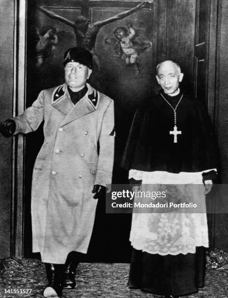 The head of the Fascist government Benito Mussolini smiling while paying a visit to Cardinal Ildefonso Schuster. Milan, 1930s