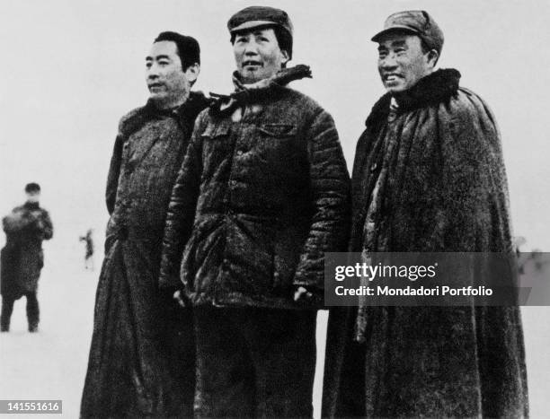 The future dictator and leader of the Chinese Communist Party Mao Zedong leading the Communists on the Long March with political commissioner Zhou...