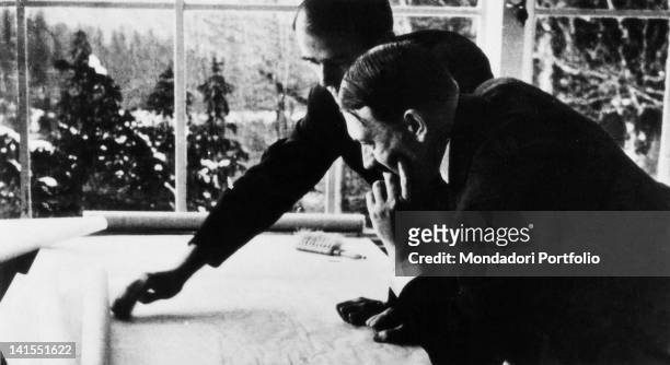 The Nazi architect Albert Speer showing to the German Chancellor Adolf Hitler the urban plans for the new Berlin. Obersalzberg, 1930s