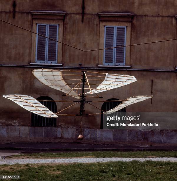 The prototype of the experimental helicopter designed by Italian inventor and engineer Enrico Forlanini hanging by a cable in the courtyard of the...