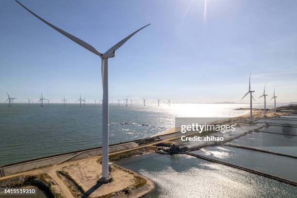 aerial view of wind turbines on the beach - beach bird's eye perspective stock pictures, royalty-free photos & images